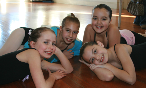 Four young female dancers posing for a photo